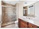 Bathroom featuring a tiled shower and single sink vanity with lots of light at 130 Riviera Dunes Way # 903, Palmetto, FL 34221