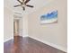 Bright bedroom features hardwood floors, crown moulding, and a ceiling fan at 130 Riviera Dunes Way # 903, Palmetto, FL 34221