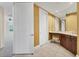 Hallway with vanity and tile flooring leading to bright open space at 130 Riviera Dunes Way # 903, Palmetto, FL 34221