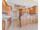 Spacious kitchen with granite countertops, stainless steel appliances, and custom cabinetry at 130 Riviera Dunes Way # 903, Palmetto, FL 34221