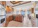 Bright kitchen with granite counters, stainless appliances, and a breakfast nook with water views at 130 Riviera Dunes Way # 903, Palmetto, FL 34221