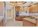 Well-equipped kitchen featuring stainless steel appliances, granite counters, and tile flooring at 130 Riviera Dunes Way # 903, Palmetto, FL 34221