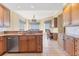 Modern kitchen area with granite countertops and stainless steel dishwasher at 130 Riviera Dunes Way # 903, Palmetto, FL 34221