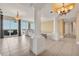 Open-concept living space featuring tiled floors, large windows with great views, and an inviting layout at 130 Riviera Dunes Way # 903, Palmetto, FL 34221