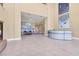Spacious lobby area with tile flooring, reception desk, and lounge seating at 130 Riviera Dunes Way # 903, Palmetto, FL 34221