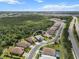 This aerial view captures a gray roof home with a well-manicured lawn in a quiet community at 13319 Deep Blue Pl, Bradenton, FL 34211