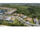 An aerial view of single Gathering homes showing well-maintained landscaping with trees at 13319 Deep Blue Pl, Bradenton, FL 34211