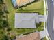 Aerial shot of home highlighting the roof, landscaping, and driveway at 13319 Deep Blue Pl, Bradenton, FL 34211