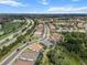 This aerial view captures a gray roof home with a well-manicured lawn in a quiet community at 13319 Deep Blue Pl, Bradenton, FL 34211