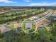 Aerial view of a residential community with a golf course, lakes, and winding roads at 13319 Deep Blue Pl, Bradenton, FL 34211