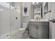 Beautiful bathroom with white tiled shower and gray vanity with granite counter tops at 13319 Deep Blue Pl, Bradenton, FL 34211