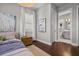 Stylish bedroom featuring dark wood floors and light gray walls with ensuite bathroom access at 13319 Deep Blue Pl, Bradenton, FL 34211
