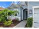 Home with blue siding, stone walkway and a front door adorned with a wreath at 13319 Deep Blue Pl, Bradenton, FL 34211