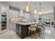 Bright, spacious kitchen featuring a center island, modern lighting, and white marble floors at 13319 Deep Blue Pl, Bradenton, FL 34211