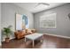 Bright living room with hardwood floors, a comfortable couch, and modern decor at 13319 Deep Blue Pl, Bradenton, FL 34211