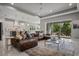 Open-concept living room flows into the kitchen, featuring elegant decor and plenty of natural light at 13319 Deep Blue Pl, Bradenton, FL 34211