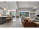 Open living space with marble floors, bar seating, and expansive outdoor view at 13319 Deep Blue Pl, Bradenton, FL 34211
