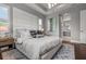 Inviting main bedroom with tray ceiling, padded headboard, and ensuite bathroom at 13319 Deep Blue Pl, Bradenton, FL 34211