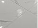 Close up of pristine white marble-like tile flooring, creating an elegant and bright atmosphere at 13319 Deep Blue Pl, Bradenton, FL 34211