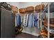Spacious walk-in closet featuring wire shelving, hardwood floors, and ample storage space at 13319 Deep Blue Pl, Bradenton, FL 34211