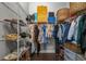 Organized walk-in closet with wire shelving and hardwood floors for optimal storage solutions at 13319 Deep Blue Pl, Bradenton, FL 34211