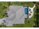Aerial view of home with a screened pool, landscaped yard and tile roof at 14210 9Th Ne Ter, Bradenton, FL 34212