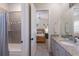 Bathroom with view into bedroom, showing a tub/shower combination at 14210 9Th Ne Ter, Bradenton, FL 34212