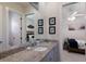 Bathroom with granite countertops and view into bedroom at 14210 9Th Ne Ter, Bradenton, FL 34212