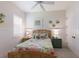 Cozy bedroom with floral bedding, bedside tables, and charming decor at 14210 9Th Ne Ter, Bradenton, FL 34212