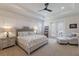 Serene bedroom with natural light, a tray ceiling, and access to a private balcony at 14210 9Th Ne Ter, Bradenton, FL 34212