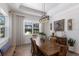Elegant dining room with a stylish light fixture and views of the backyard at 14210 9Th Ne Ter, Bradenton, FL 34212