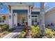 Welcoming front entrance with decorative columns, stone accents, and vibrant landscaping at 14210 9Th Ne Ter, Bradenton, FL 34212