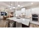 Bright open kitchen with an island, pendant lighting, and stainless steel appliances at 14210 9Th Ne Ter, Bradenton, FL 34212