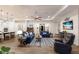 Spacious living room with open floor plan featuring a tray ceiling and modern furnishings at 14210 9Th Ne Ter, Bradenton, FL 34212