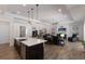 Spacious open-concept kitchen and living room showcasing an island and comfortable seating at 14210 9Th Ne Ter, Bradenton, FL 34212
