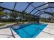 Inviting screened-in pool area with lush landscaping and clear blue water, perfect for relaxation and outdoor enjoyment at 14210 9Th Ne Ter, Bradenton, FL 34212