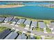 An aerial view of the neighborhood with many single Gathering homes surrounding a scenic lake at 16148 Preservation Blvd, Punta Gorda, FL 33982
