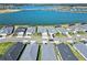 Expansive aerial shot captures the neighborhood's well-maintained homes and a large lake at 16148 Preservation Blvd, Punta Gorda, FL 33982