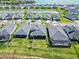 Beautiful aerial view of the community with a large lake in the background and many single Gathering homes at 16148 Preservation Blvd, Punta Gorda, FL 33982