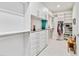 Walk-in closet with custom shelves, drawers, and hanging rods for ample storage at 16148 Preservation Blvd, Punta Gorda, FL 33982