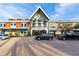 Commercial building with brick accents, prominent signage and ample parking, showcasing a professional and inviting facade at 16148 Preservation Blvd, Punta Gorda, FL 33982