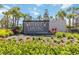 A beautifully landscaped entrance sign for Waterview Landing by Toll Brothers, featuring lush greenery and vibrant flowers at 16148 Preservation Blvd, Punta Gorda, FL 33982