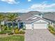 Beautiful two-story home with a three-car garage, lovely landscaping, and waterfront views at 16148 Preservation Blvd, Punta Gorda, FL 33982