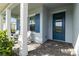 Charming front porch with pavers and Adirondack chairs at 16148 Preservation Blvd, Punta Gorda, FL 33982
