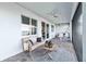 Charming lanai with plush seating, elegant decor, and serene views of the outdoors at 16148 Preservation Blvd, Punta Gorda, FL 33982