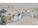 Open-concept living space with large tile, eat in kitchen, and modern decor at 16148 Preservation Blvd, Punta Gorda, FL 33982