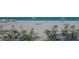 Expansive beachfront featuring sun loungers, vibrant umbrellas, and tranquil ocean views at 1701 Gulf Of Mexico Dr # 502, Longboat Key, FL 34228