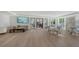 Large common area with wood floors, modern furniture, and plenty of natural light at 1701 Gulf Of Mexico Dr # 502, Longboat Key, FL 34228