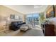 Inviting living room with plush seating, large windows, and a view of the beach and ocean at 1701 Gulf Of Mexico Dr # 502, Longboat Key, FL 34228