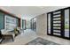 Modern lobby space with neutral armchairs, sleek tile flooring and modern recessed lighting at 1701 Gulf Of Mexico Dr # 502, Longboat Key, FL 34228